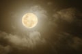 Full moon shining through thick clouds Royalty Free Stock Photo