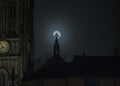 A full moon and the silhouette of Leeds Minster in Yorkshire