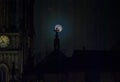 A full moon and the silhouette of Leeds Minster in Yorkshire