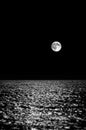 Full moon in the sky above the waves of the sea, long exposure Royalty Free Stock Photo