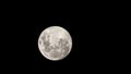 A full moon in the sky, a natural satellite visible from the ground