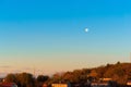 Full moon in the sky over the city, dawn in the village Royalty Free Stock Photo