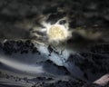The full moon in the sky over the mountain snow peak Royalty Free Stock Photo