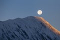 Full moon during a sunrise on the background of snow-capped in Himalayas mountains in Nepal Royalty Free Stock Photo