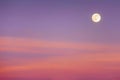 Full moon with sunset clouds