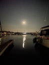 Image of the full moon reflecting in the ocean harbour Royalty Free Stock Photo
