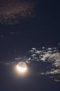 Full moon twilight with craters on the surface and dark sky, close up nature background