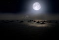 Full moon and warships over the sea at night Royalty Free Stock Photo