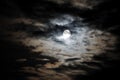 Full moon and white clouds on black night sky Royalty Free Stock Photo