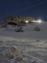 Full moon winter night fairytale, cottages under a lot of snow Royalty Free Stock Photo