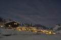 Full moon winter night fairytale, houses under snow Royalty Free Stock Photo