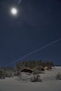 Full moon winter night fairytale, cottages under a lot of snow Royalty Free Stock Photo