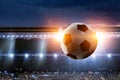 Full night football arena in lights with ball close up Royalty Free Stock Photo