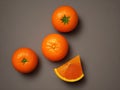 Full oranges plus a triangle sliced orange