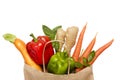 Full paper bag of different health food on a white background. The concept of healthy food, proper nutrition. Top view. Flat lay Royalty Free Stock Photo