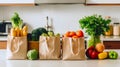 Full paper bags of food on the table in the white kitchen. Healthy and fresh eco-products for a balanced diet