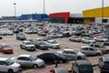 Full parking at the supermarket on a cloudy afternoon