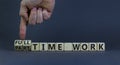 Full or part time work symbol. Businessman turns cubes and changes words `full-time work` to `part-time work`. Beautiful grey Royalty Free Stock Photo