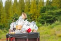 Full of plastic cup in recycle bin in the nature. Royalty Free Stock Photo