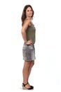 Full portrait of a woman in a denim skirt on white background, Royalty Free Stock Photo