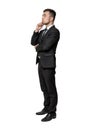 Full portrait of young man in business suit, thinking about something, isolated on a white background Royalty Free Stock Photo