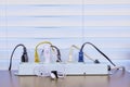 Full Power Strip On Desk With Venetian Blind Background Royalty Free Stock Photo