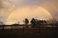 Full rainbow at sunset Royalty Free Stock Photo