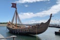 full-scale viking ship docked at harbor, with sails furled and oars in place Royalty Free Stock Photo