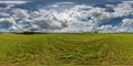 full seamless hdri 360 panorama among farming field with cut grass and clouds in overcast sky in equirectangular spherical Royalty Free Stock Photo