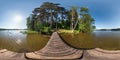 Full seamless panorama 360 by 180 angle view on the pier of a huge forest lake in sunny summer day in equirectangular projection, Royalty Free Stock Photo