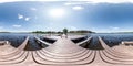 Full seamless panorama 360 by 180 angle view wooden pier for ships on huge forest lake in sunny summer day in equirectangular Royalty Free Stock Photo