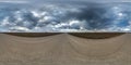 Full seamless spherical hdri panorama 360 degrees angle view on gravel road among fields in spring day with storm clouds before Royalty Free Stock Photo