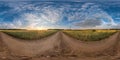 Full seamless spherical hdri panorama 360 degrees angle view on gravel road among fields in summer evening sunset with awesome