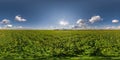 Full seamless spherical hdri panorama 360 degrees angle view on among green farming fields in summer day with awesome clouds in Royalty Free Stock Photo