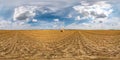 Full seamless spherical hdri panorama 360 degrees angle view among harvested rye and wheat fields with Hay bales in summer day Royalty Free Stock Photo