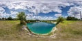 full seamless spherical hdri panorama 360 degrees angle view on limestone coast of huge green quarry or lake near pine forest with Royalty Free Stock Photo