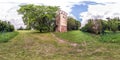 Full seamless spherical hdri panorama 360 degrees angle view on old stone abandoned fire tower in village park in equirectangular Royalty Free Stock Photo