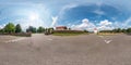 Full seamless spherical hdri panorama 360 degrees angle view on parking near stone fence small