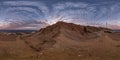 Full seamless spherical hdri 360 panorama view of sunset on coast of sea high in sandy mountains with awesome clouds in Royalty Free Stock Photo