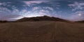 full seamless spherical hdri 360 panorama view of sunset on coast of sea high in sandy mountains with awesome clouds in Royalty Free Stock Photo