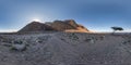 Full seamless spherical hdri 360 panorama view of sunset in desert near tree with sun shines from behind the mountain on coast of Royalty Free Stock Photo