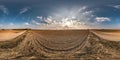 Full seamless spherical panorama 360 degrees angle view near gravel road among meadow fields in spring evening sunset with awesome