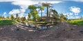 Full seamless spherical panorama 360 by 180 degrees angle view on the shore of small river with ducks in city park in summer day