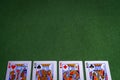 Full set of King Playing cards on green felt background Royalty Free Stock Photo