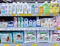 Full shelves of varied baby cosmetics and diapers in a chain supermarket