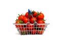 Full shopping basket with red ripe tomatoes on a white isolated background. Royalty Free Stock Photo