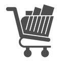 Full shopping cart glyph icon. Market trolley with product packages. Commerce vector design concept, solid style