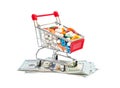 Full shopping cart with pills on dollar bills on white background Royalty Free Stock Photo