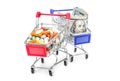 Full shopping cart with pills and shopping cart with money on white Royalty Free Stock Photo