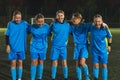 full shot of five members of school girls football team in a stadium having practice, team work in football Royalty Free Stock Photo